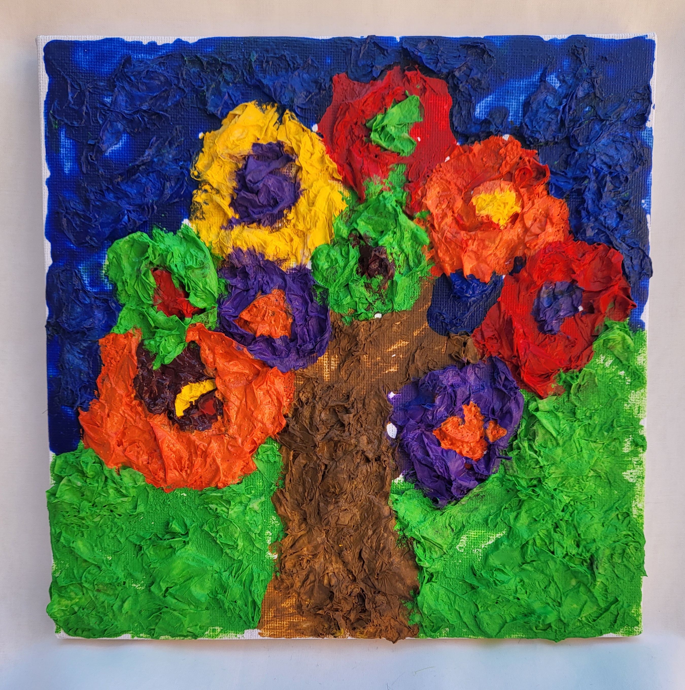 Picture of a tree made with coloured paper