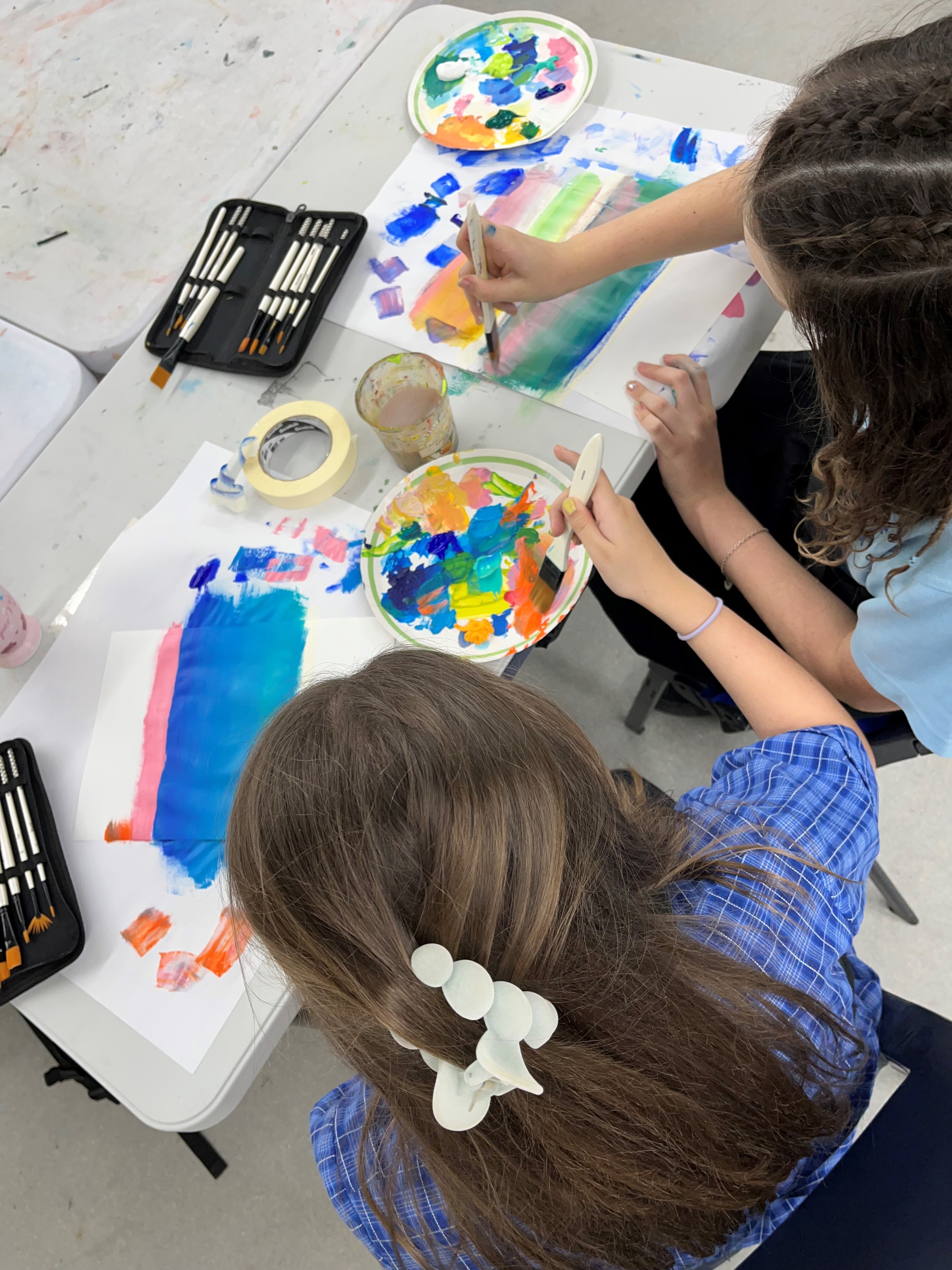 girls painting with watercolour