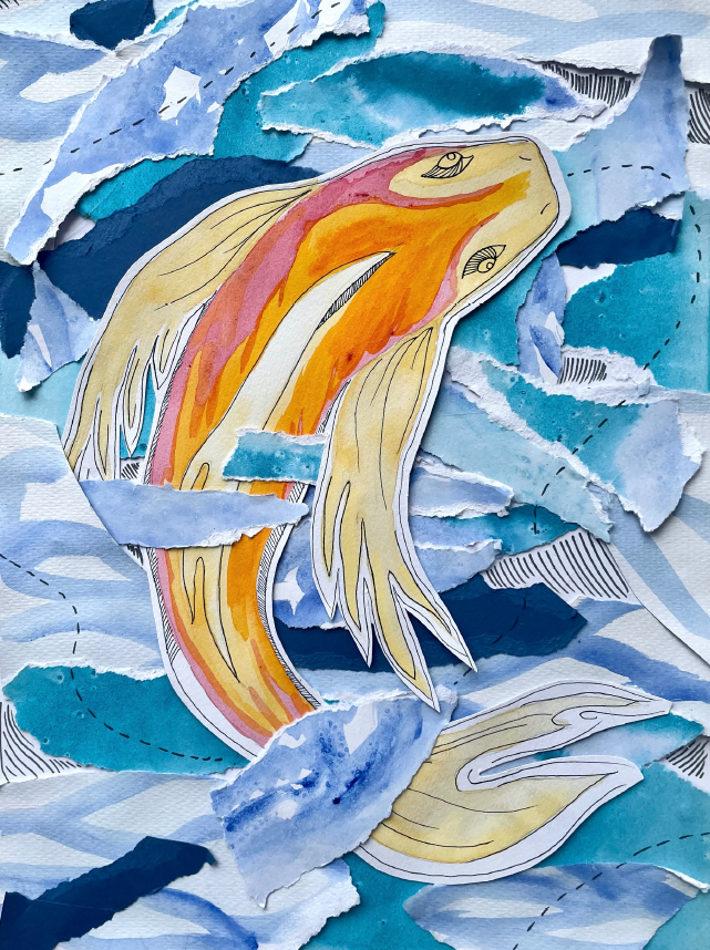 A yellow and orange fish in blue water.
