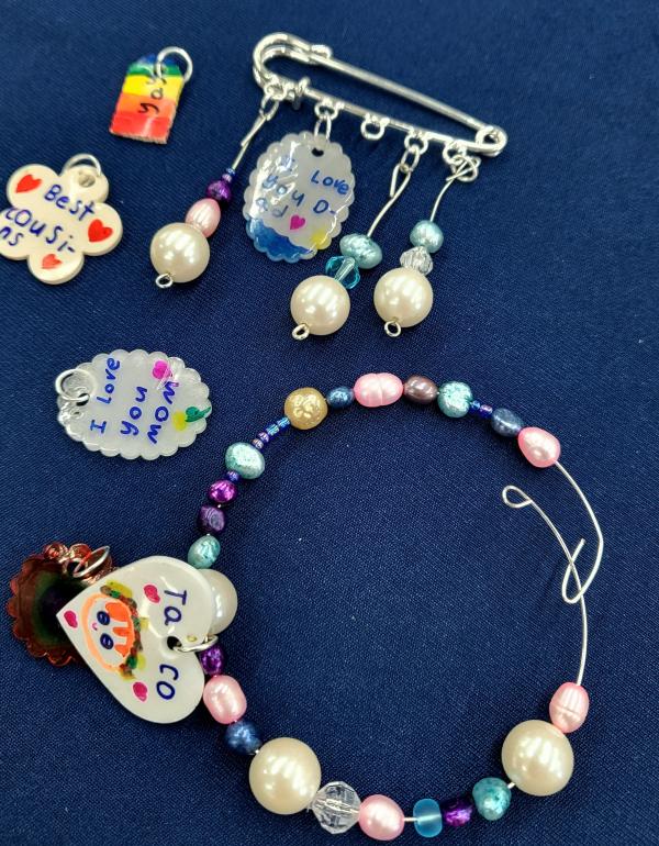 Jewellery made using beads, kilt pins, memory wire and shrink plastic.