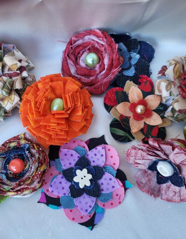 Multiple fabric flowers of many different colours