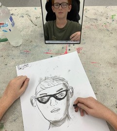 Drawing of a face with glasses