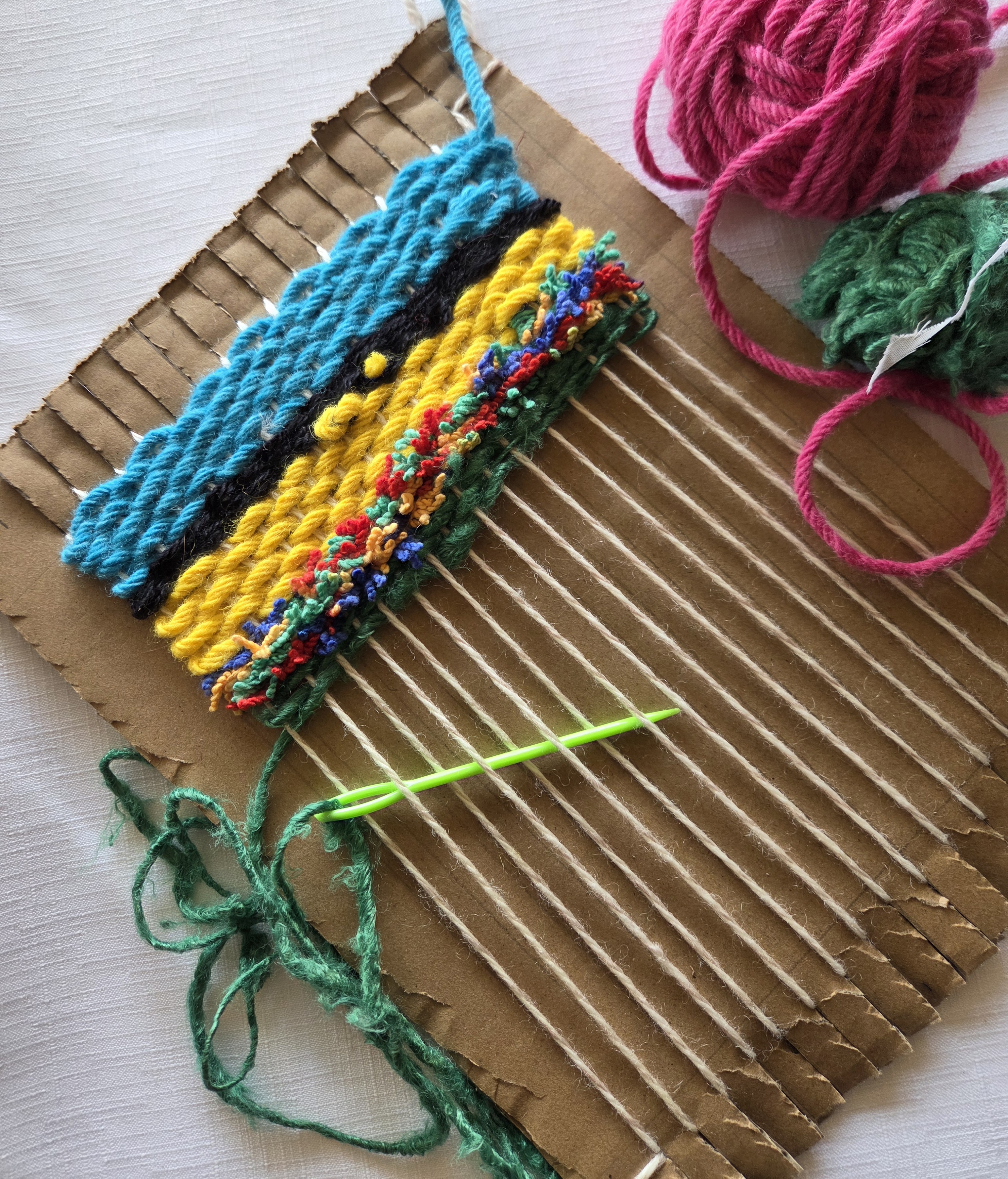 cardboard loom with wool weaving