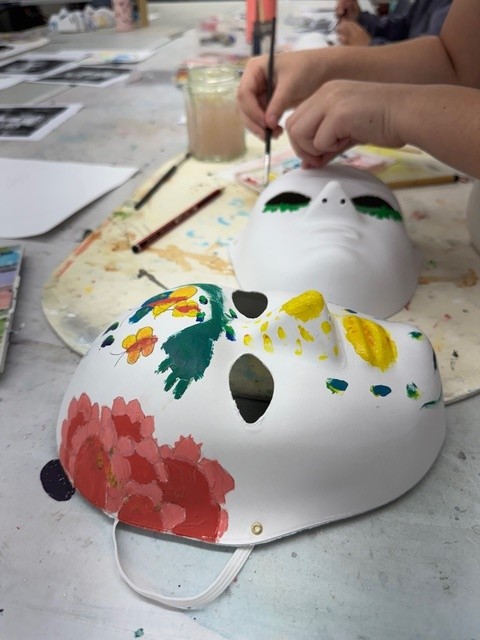 Hand painting on a white paper machai mask