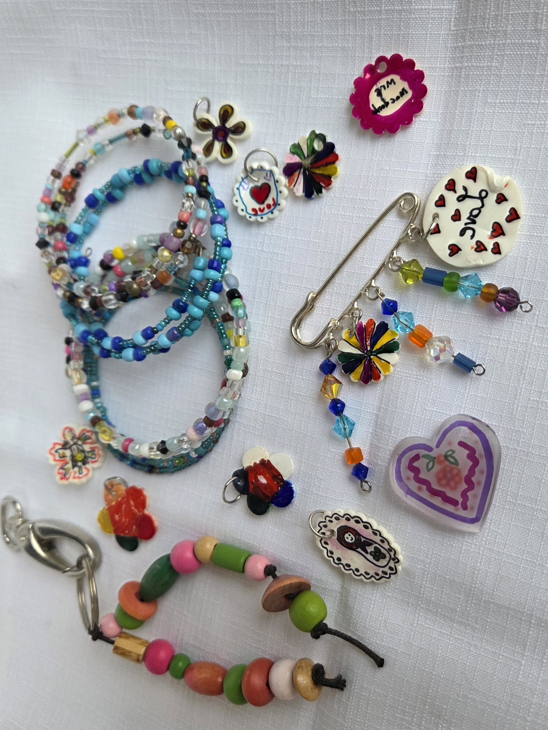 Image of colourful beads, bracelets and charms