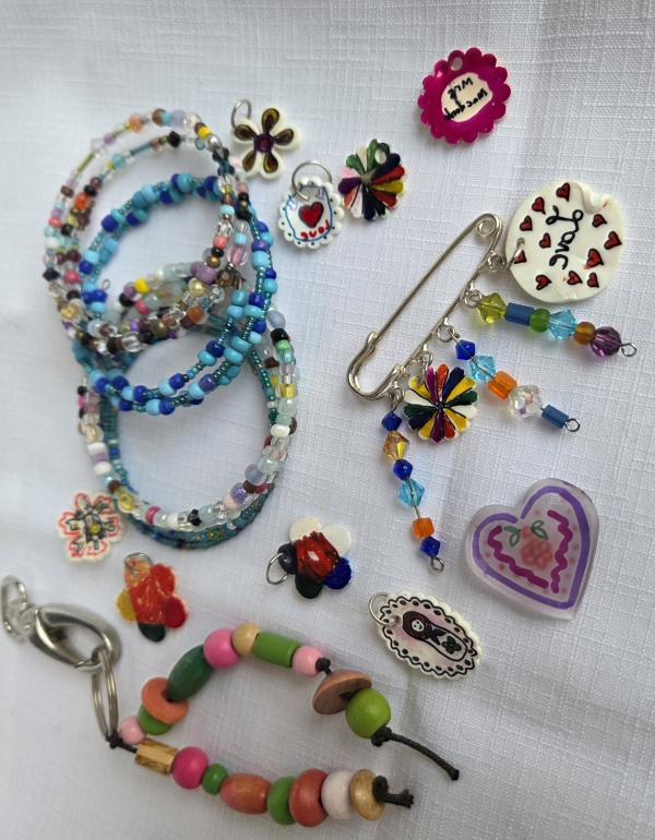 Image of colourful beads, bracelets and charms