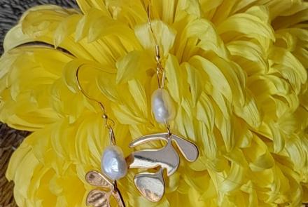 Pearl Earrings on a yellow flower